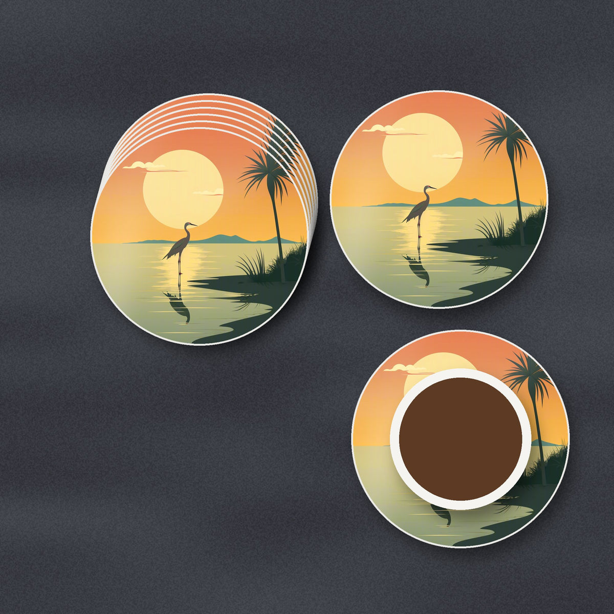 Heron at Sunset round ceramic coasters stacked on a slate kitchen worktop