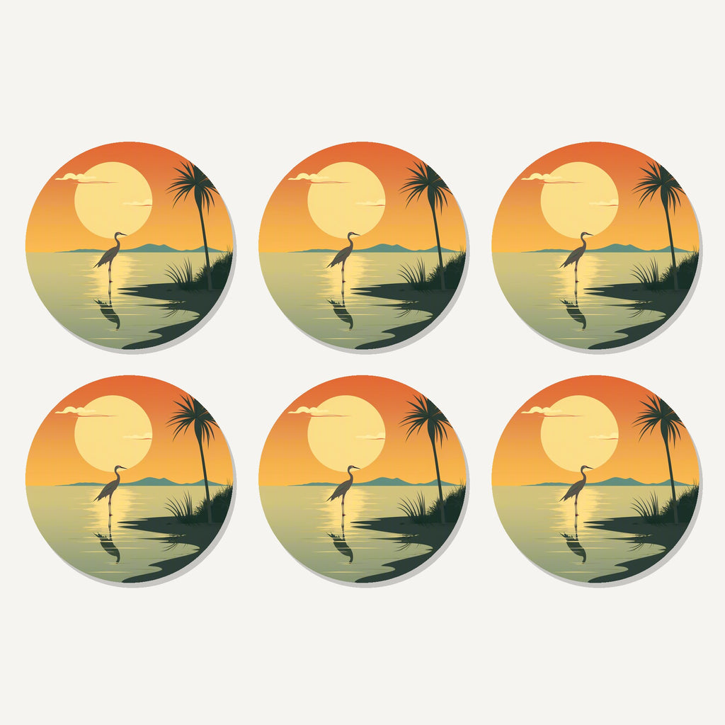 Flat lay of the heron at sunset artwork on six round coasters
