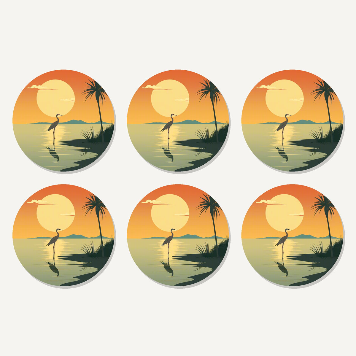 Flat lay of the heron at sunset artwork on six round coasters