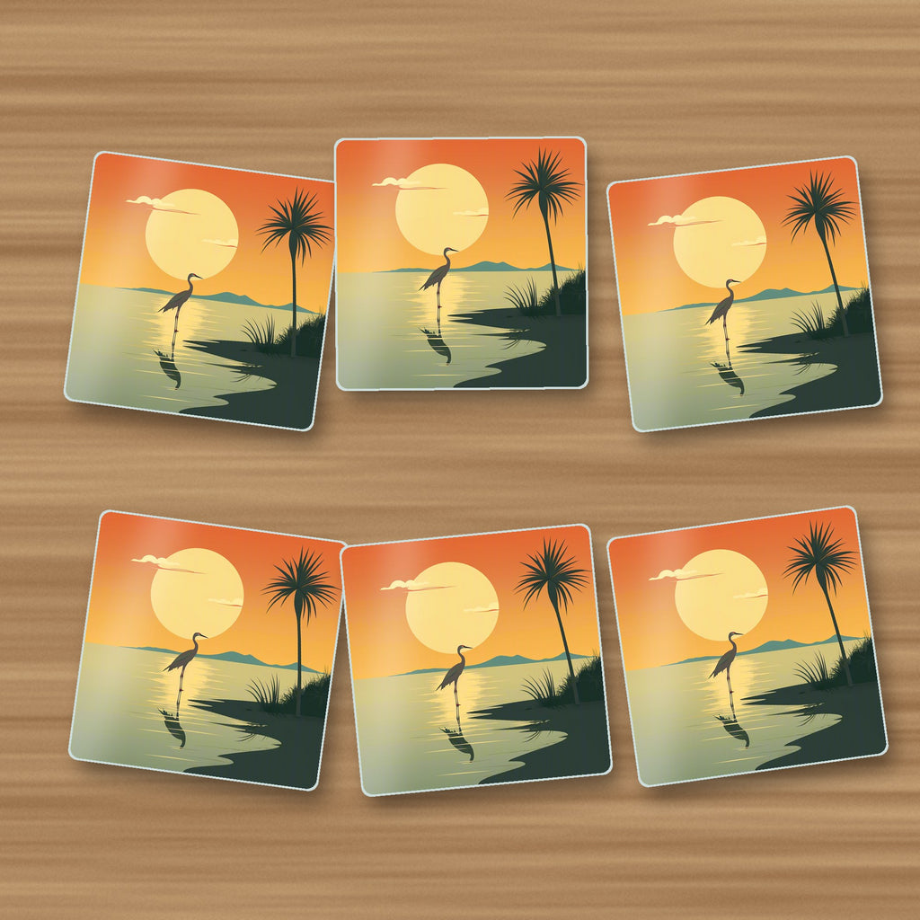 Heron at Sunset square glass coasters, set of 6, on an oak coffee table