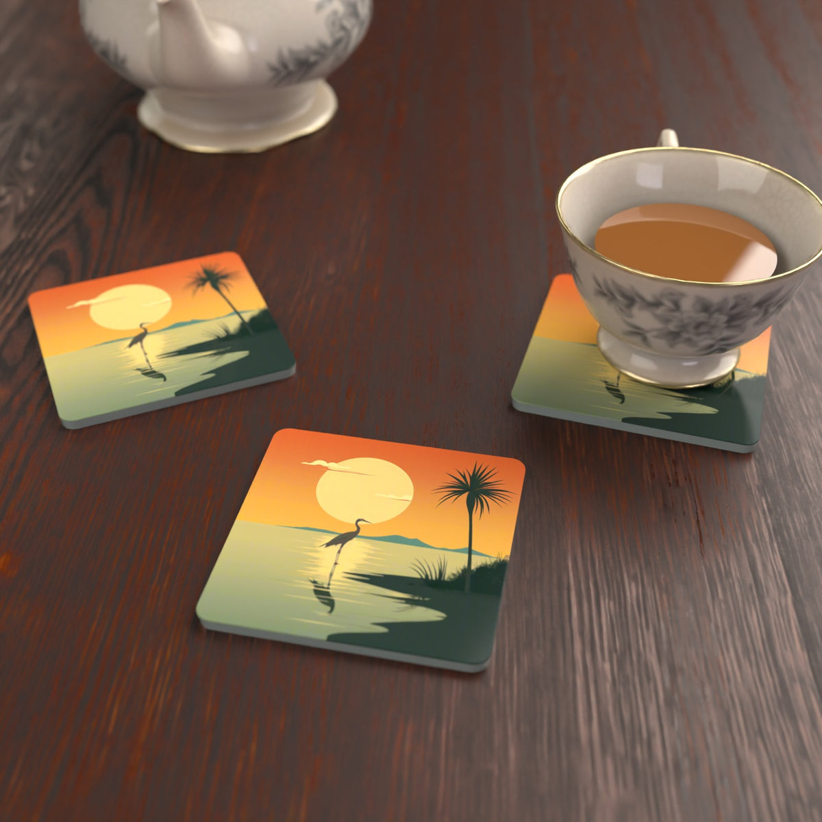 Heron at Sunset Square Glass Coasters – Set of 6 – lifestyle mockup with a teacup