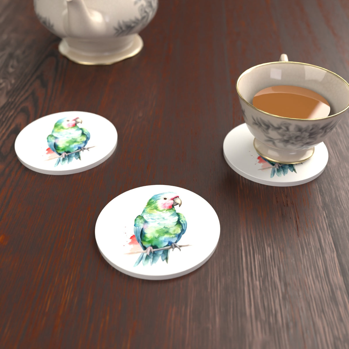 Watercolour Green Parrot on a Branch Round Ceramic Coasters – Set of 6 – lifestyle mockup with a teacup