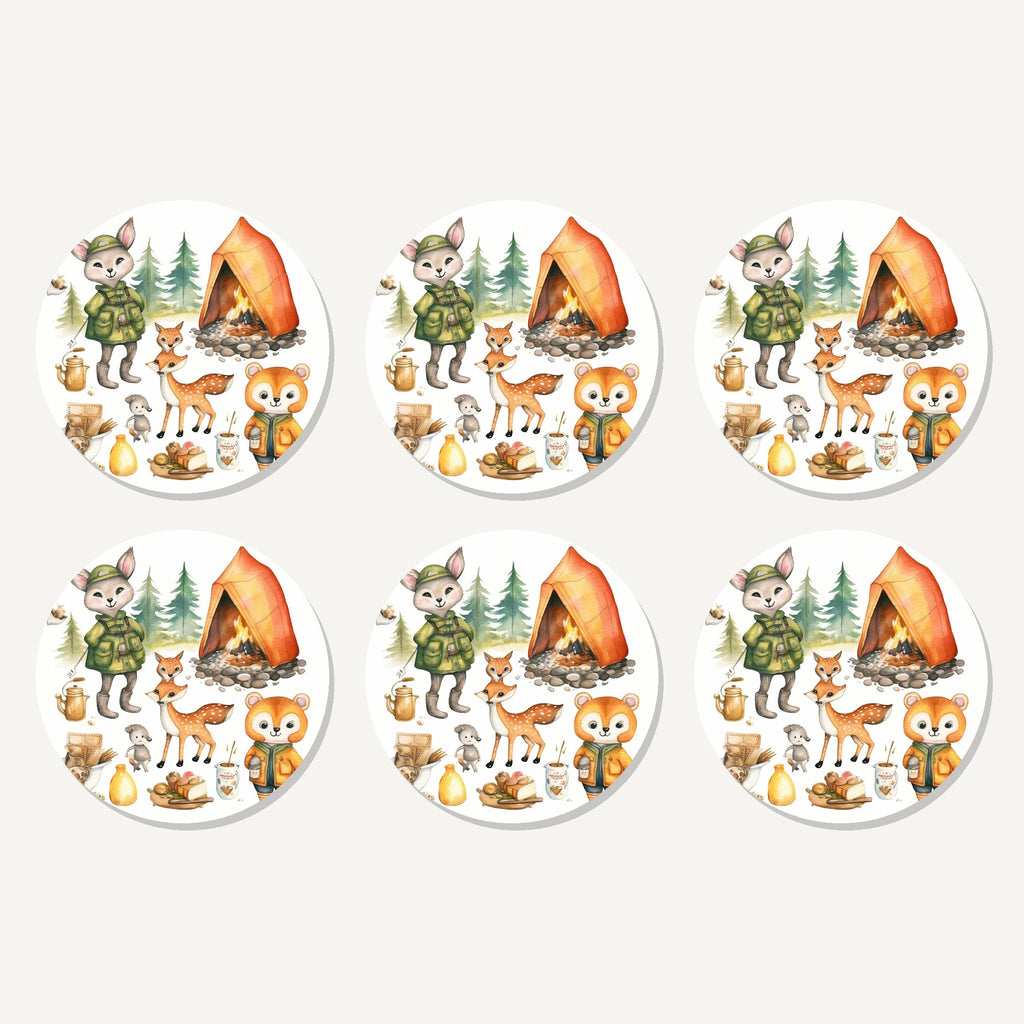 Flat lay of the woodland camping friends artwork on six round coasters