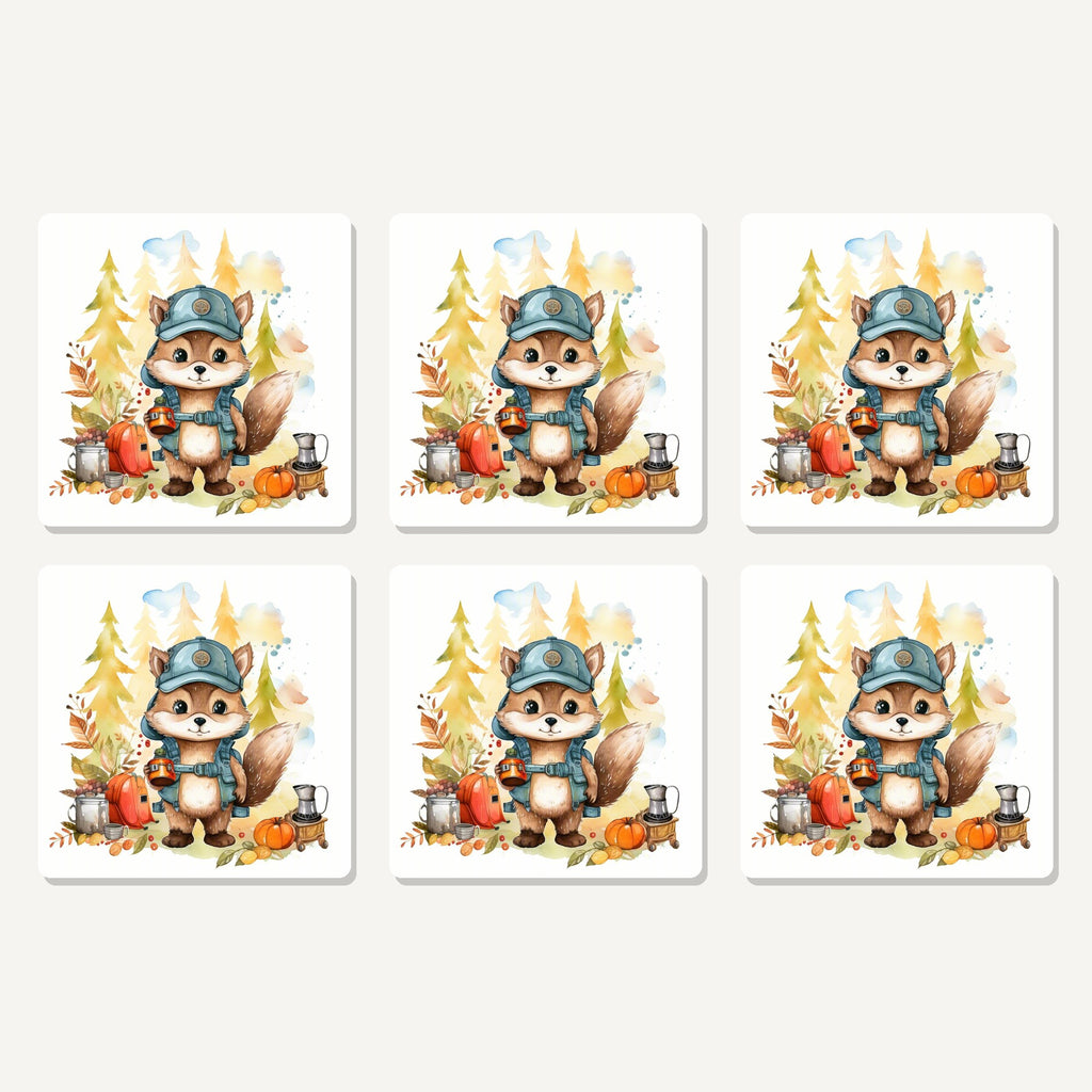 Flat lay of the squirrel camper artwork on six square coasters