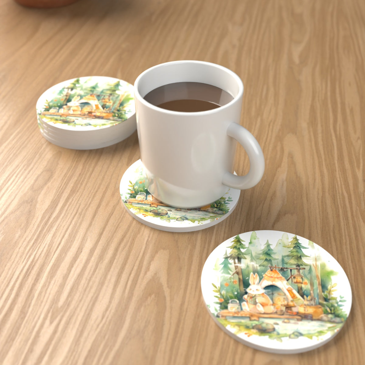 Rabbit Campsite in the Pines Round Ceramic Coasters – Set of 6 – lifestyle mockup with a mug of coffee
