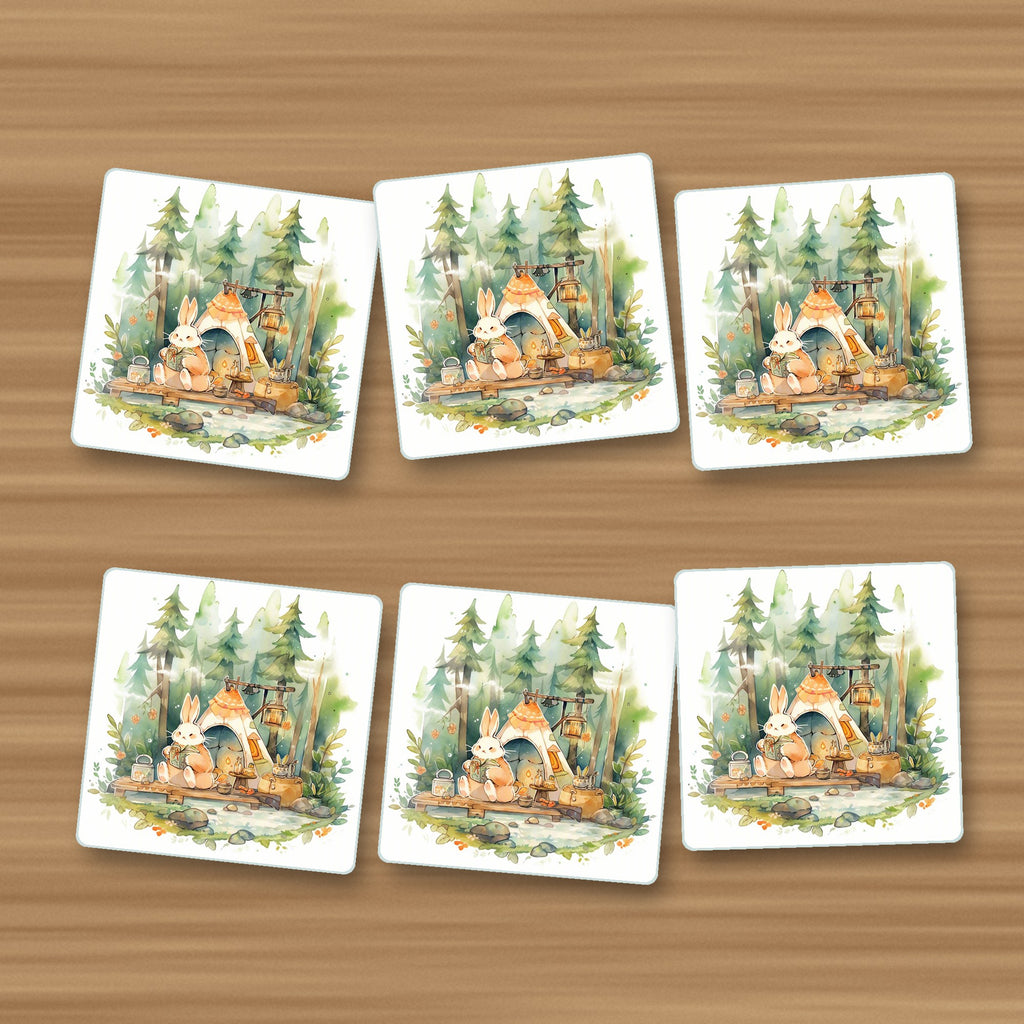 Rabbit Campsite in the Pines square glass coasters, set of 6, on an oak coffee table