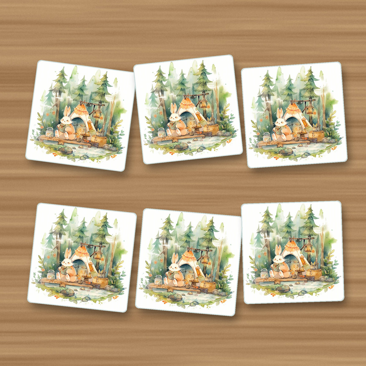 Rabbit Campsite in the Pines square glass coasters, set of 6, on an oak coffee table