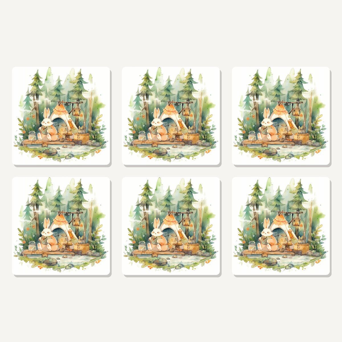 Flat lay of the rabbit campsite in the pines artwork on six square coasters
