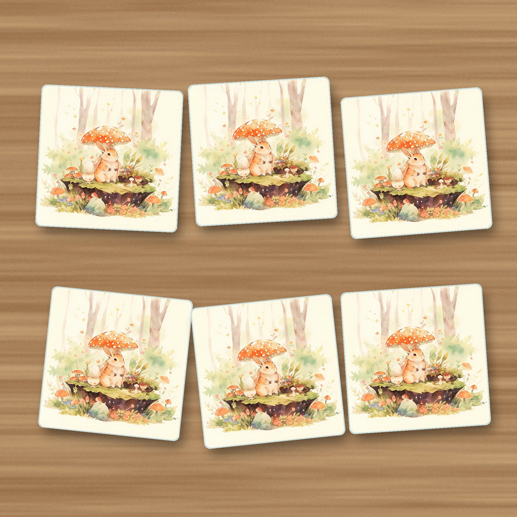Rabbit under a Toadstool square glass coasters, set of 6, on an oak coffee table