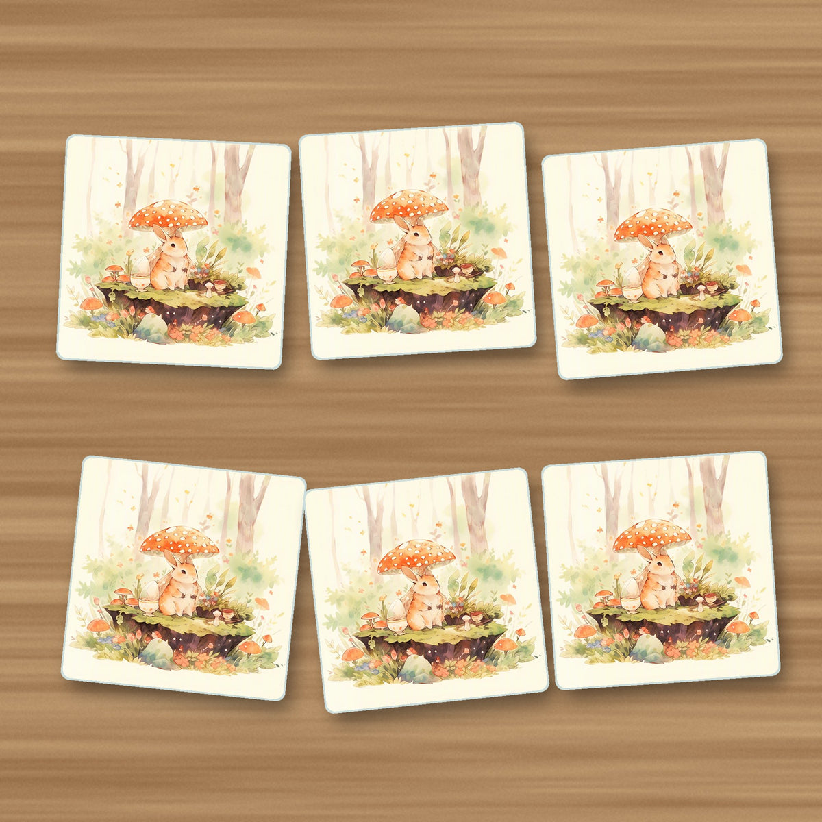 Rabbit under a Toadstool square glass coasters, set of 6, on an oak coffee table