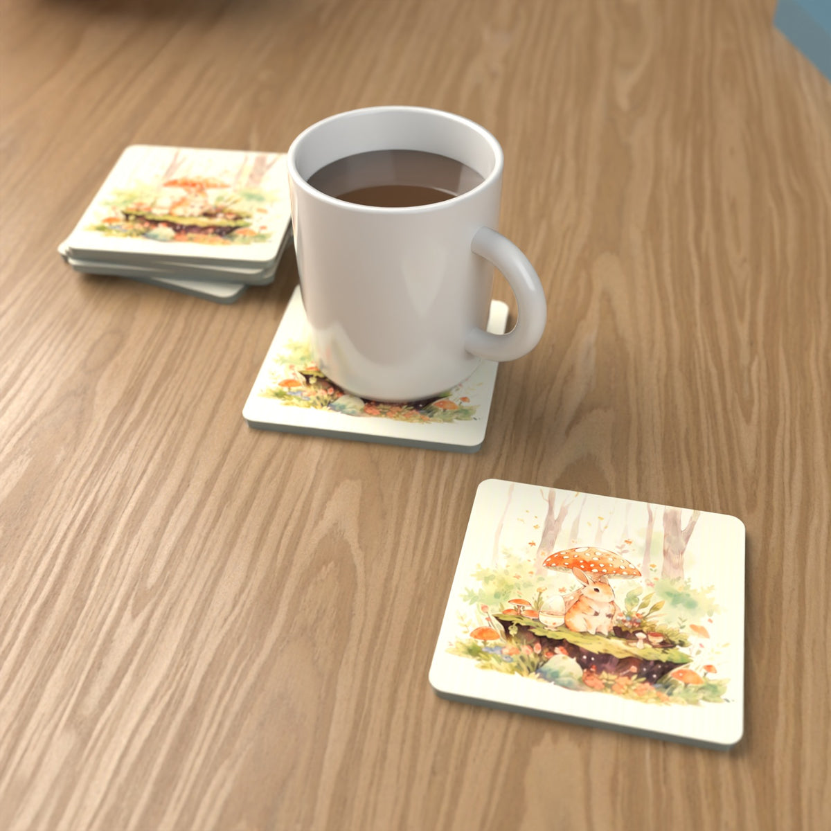 Rabbit under a Toadstool Square Glass Coasters – Set of 6 – lifestyle mockup with a mug of coffee