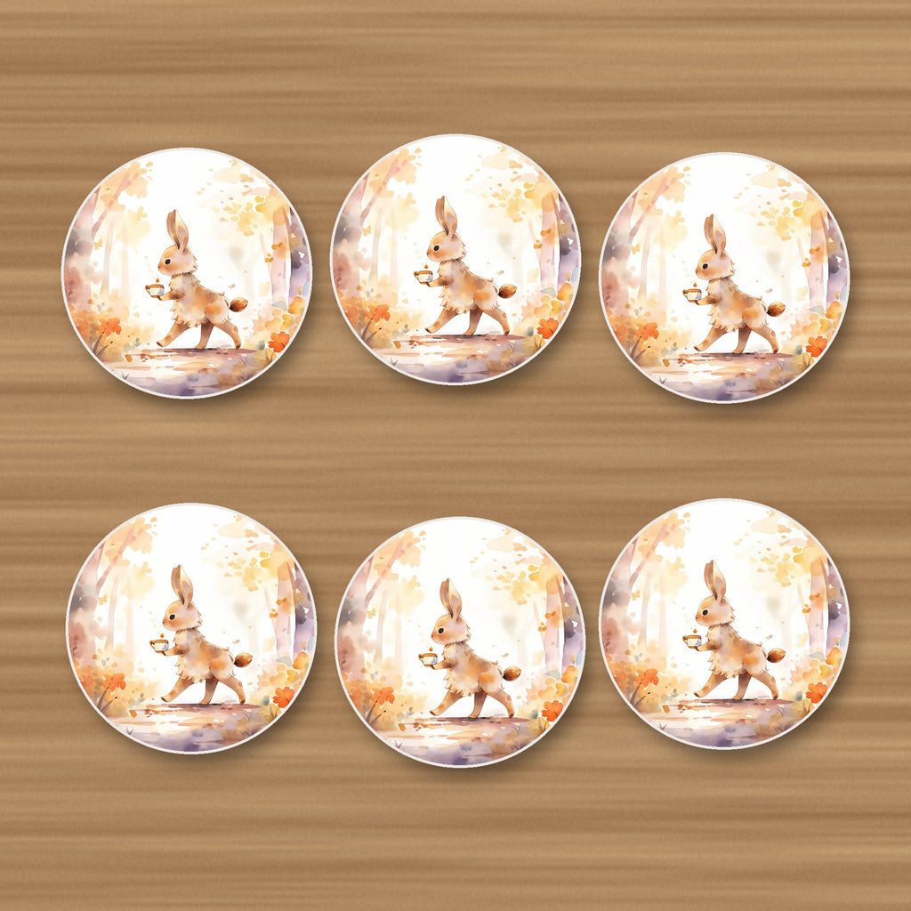 Rabbit on an Autumn Woodland Path round ceramic coasters, set of 6, on an oak coffee table