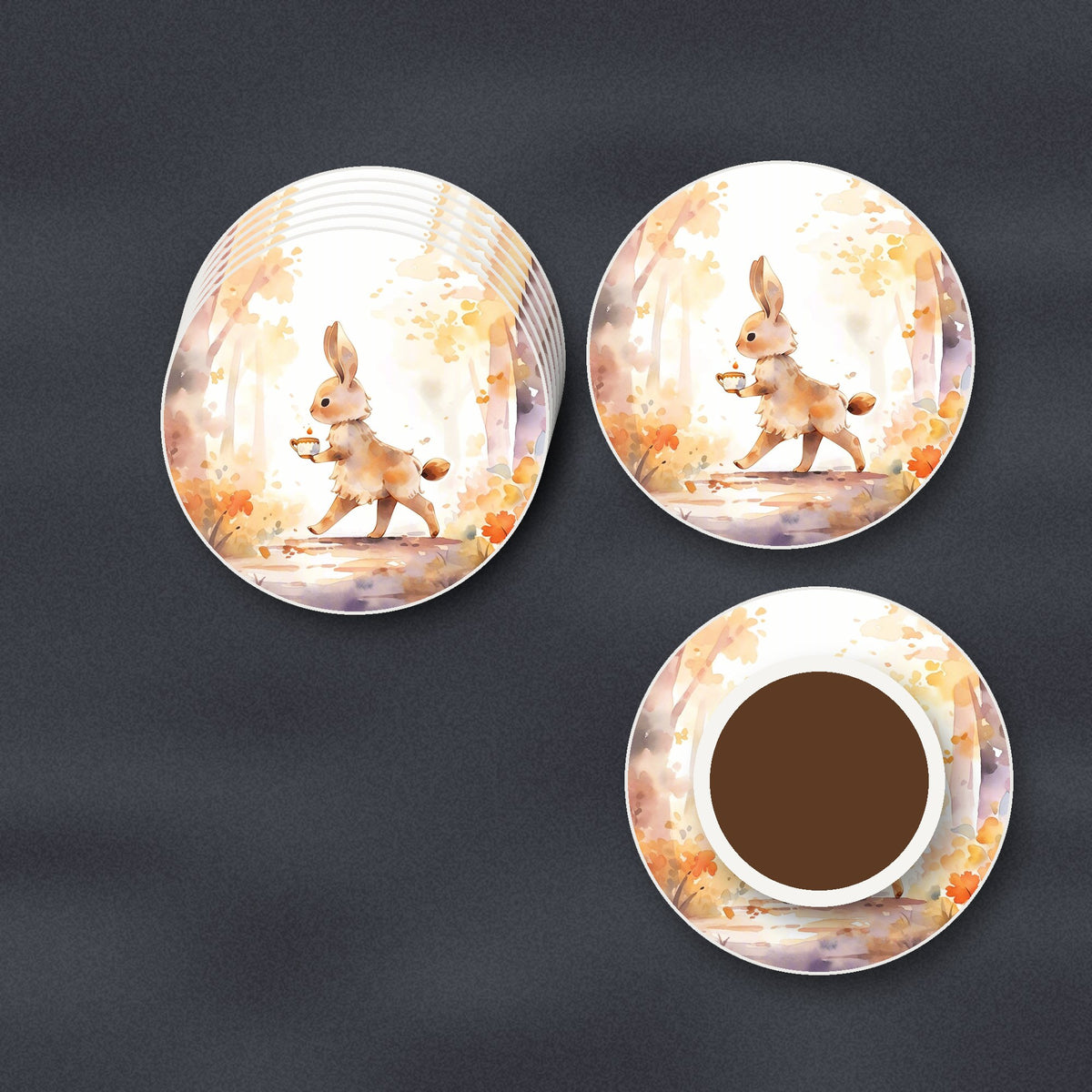 Rabbit on an Autumn Woodland Path round ceramic coasters stacked on a slate kitchen worktop