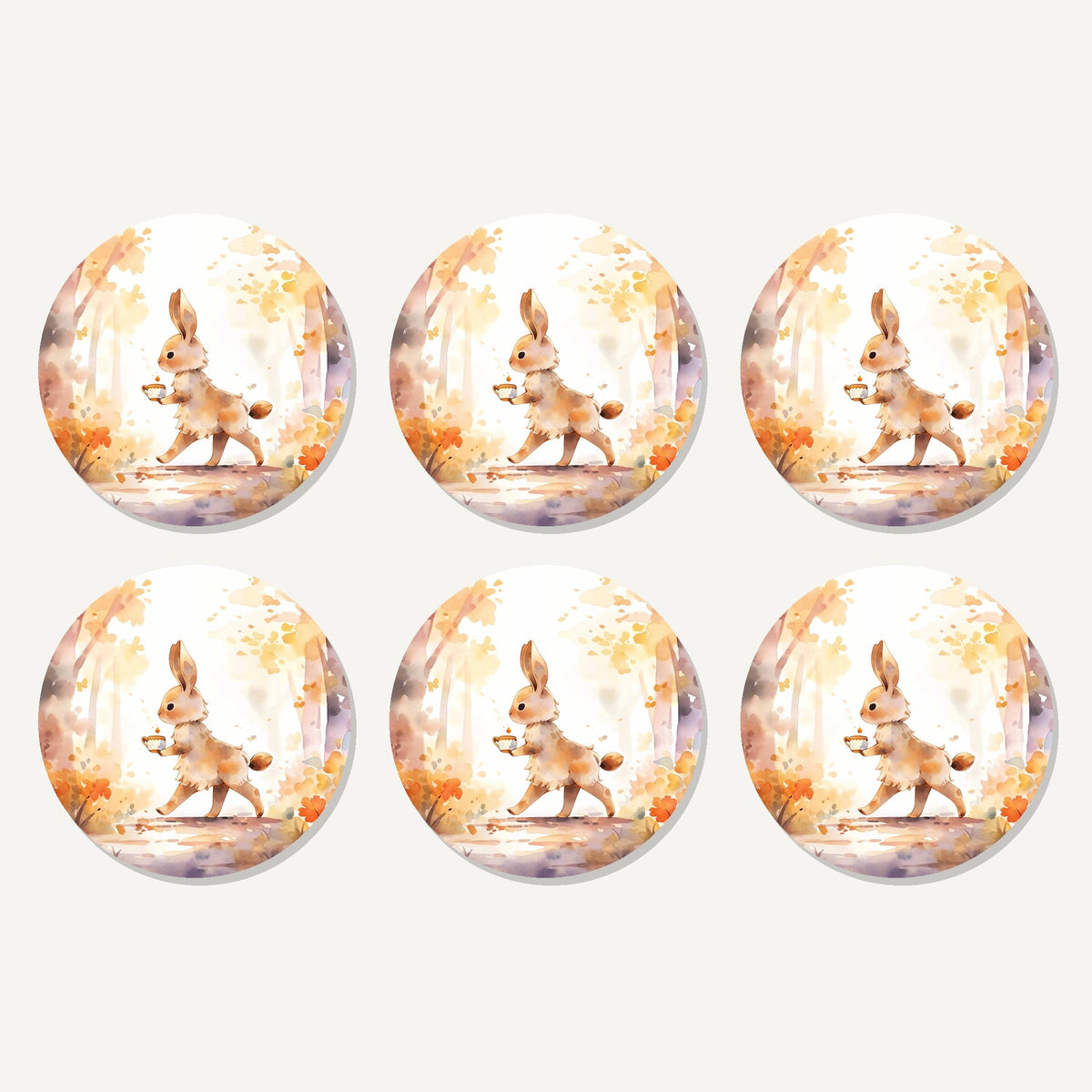 Flat lay of the rabbit on an autumn woodland path artwork on six round coasters