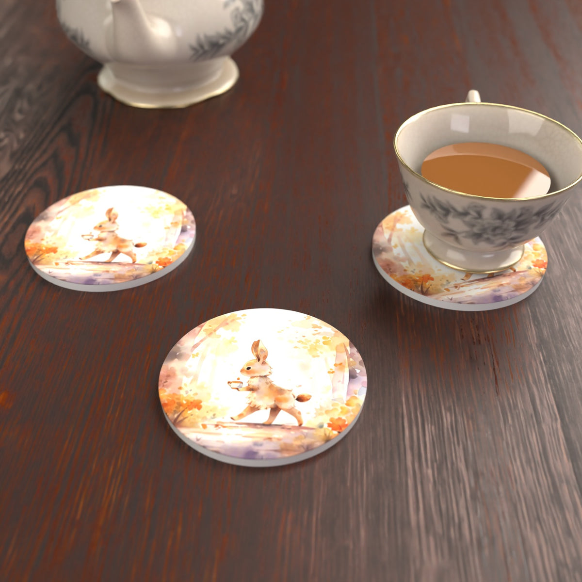 Rabbit on an Autumn Woodland Path Round Ceramic Coasters – Set of 6 – lifestyle mockup with a teacup