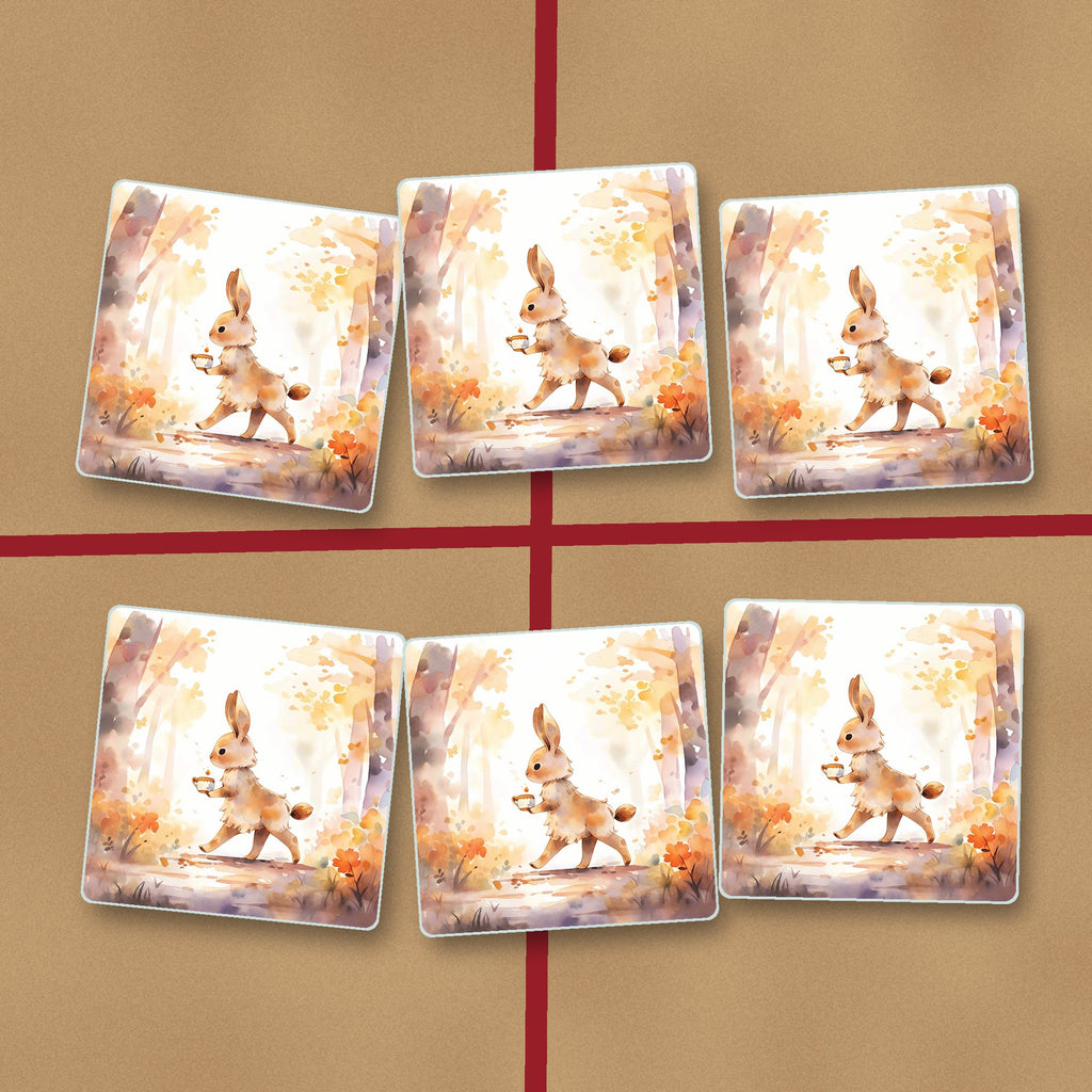 Rabbit on an Autumn Woodland Path square glass coasters on kraft gift wrap