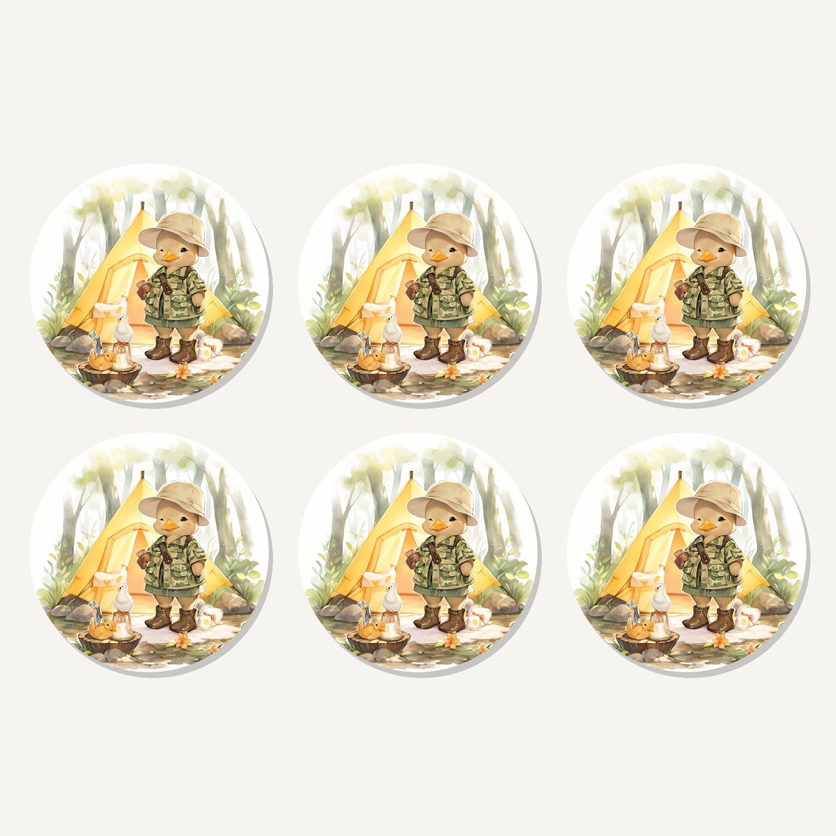 Flat lay of the duckling camper artwork on six round coasters