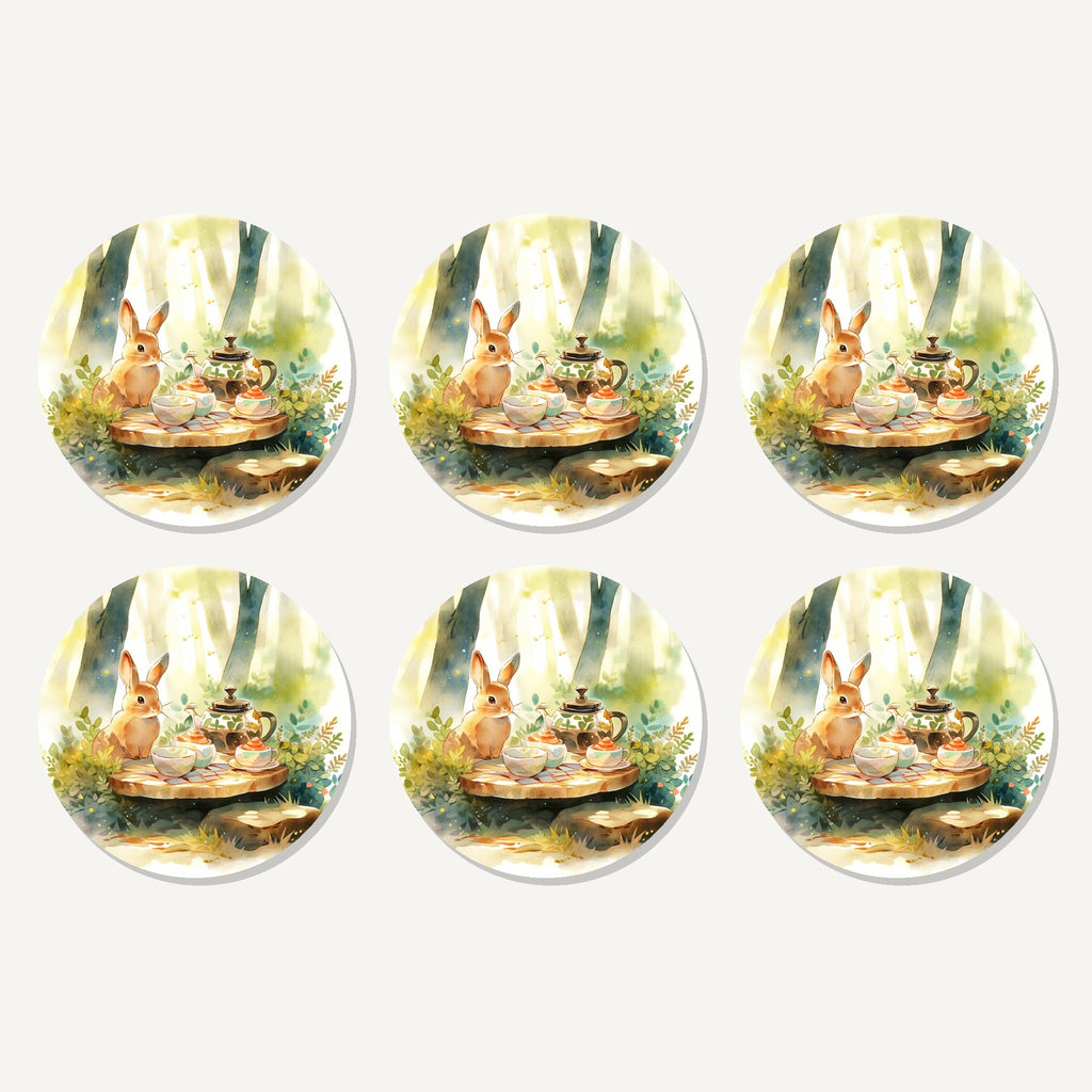 Flat lay of the rabbit woodland tea party artwork on six round coasters