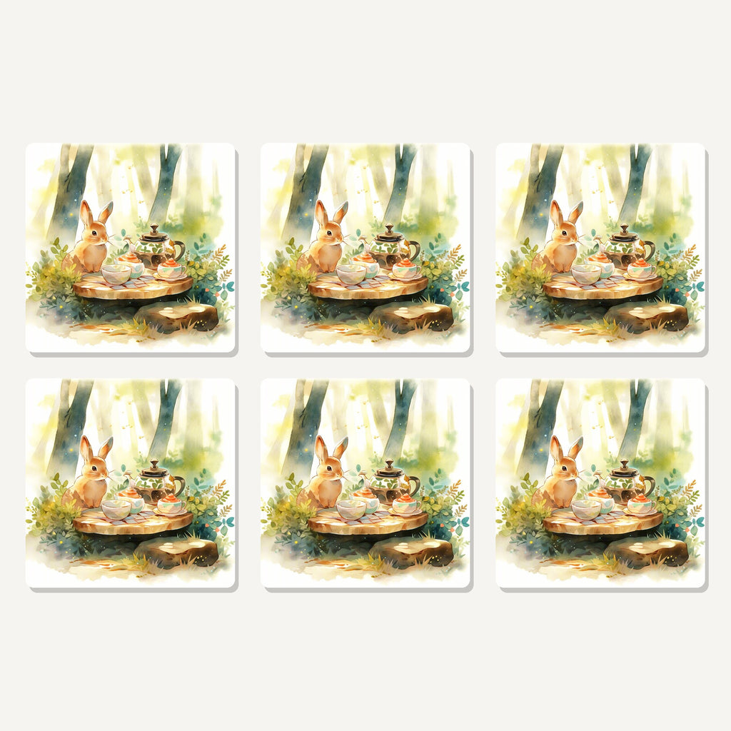 Flat lay of the rabbit woodland tea party artwork on six square coasters