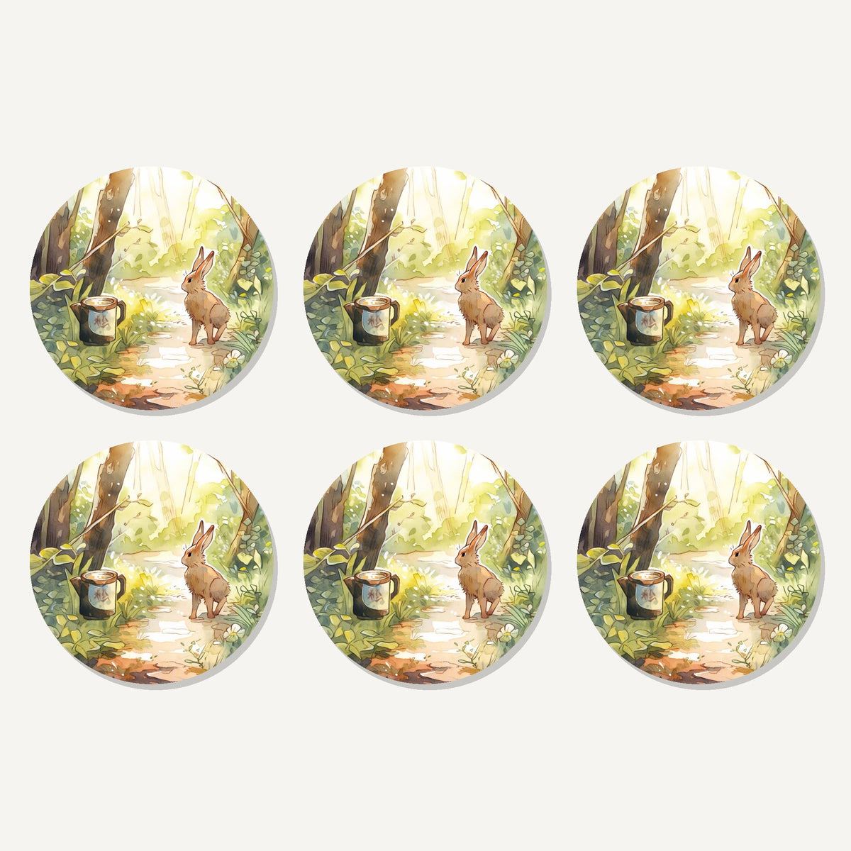 Flat lay of the hare on a sunny woodland path artwork on six round coasters