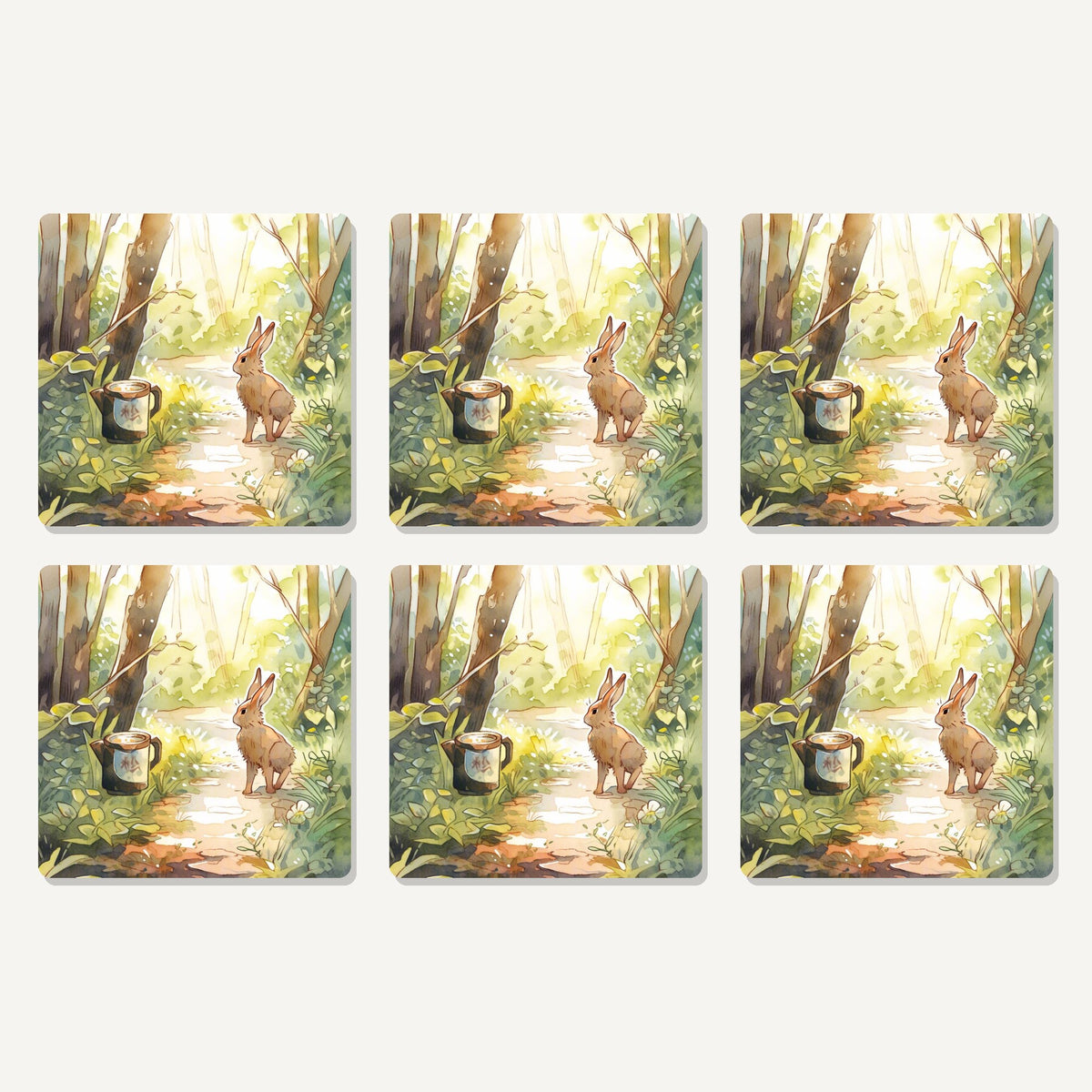 Flat lay of the hare on a sunny woodland path artwork on six square coasters