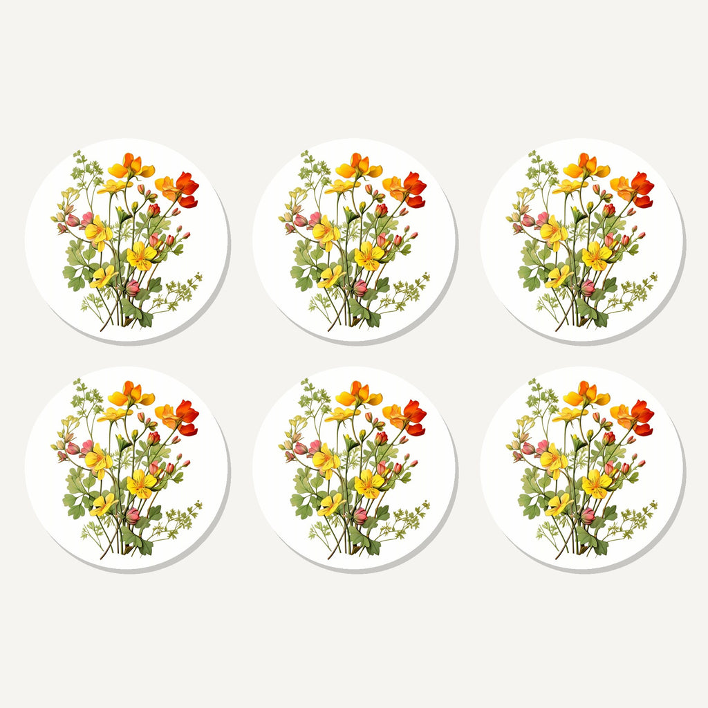 Flat lay of the watercolour yellow wildflowers artwork on six round coasters
