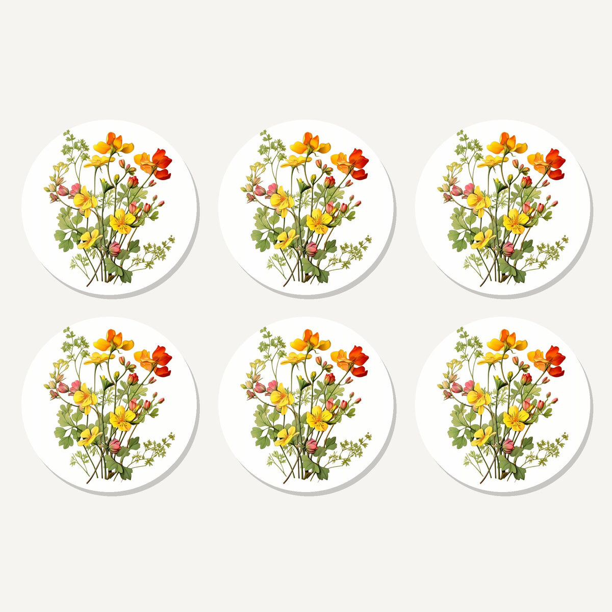 Flat lay of the watercolour yellow wildflowers artwork on six round coasters