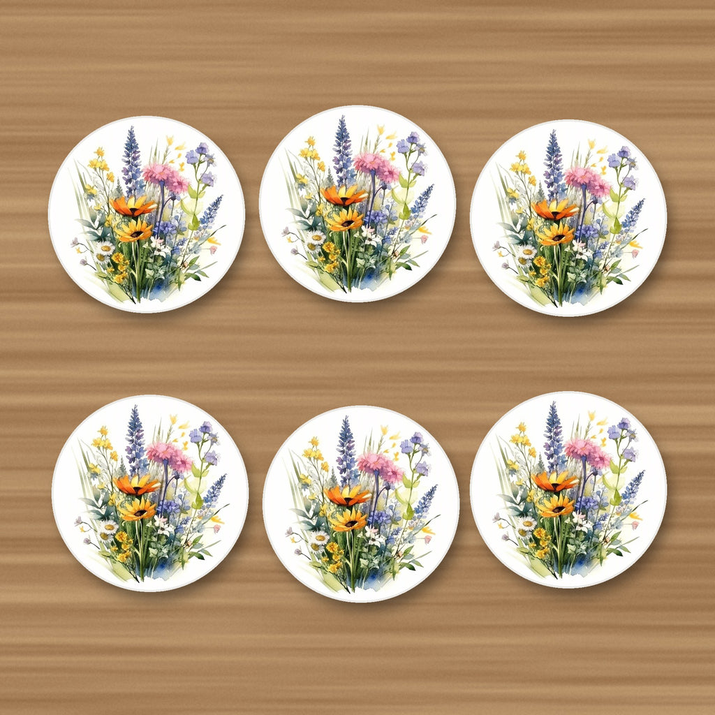 Watercolour Wildflower Posy round ceramic coasters, set of 6, on an oak coffee table