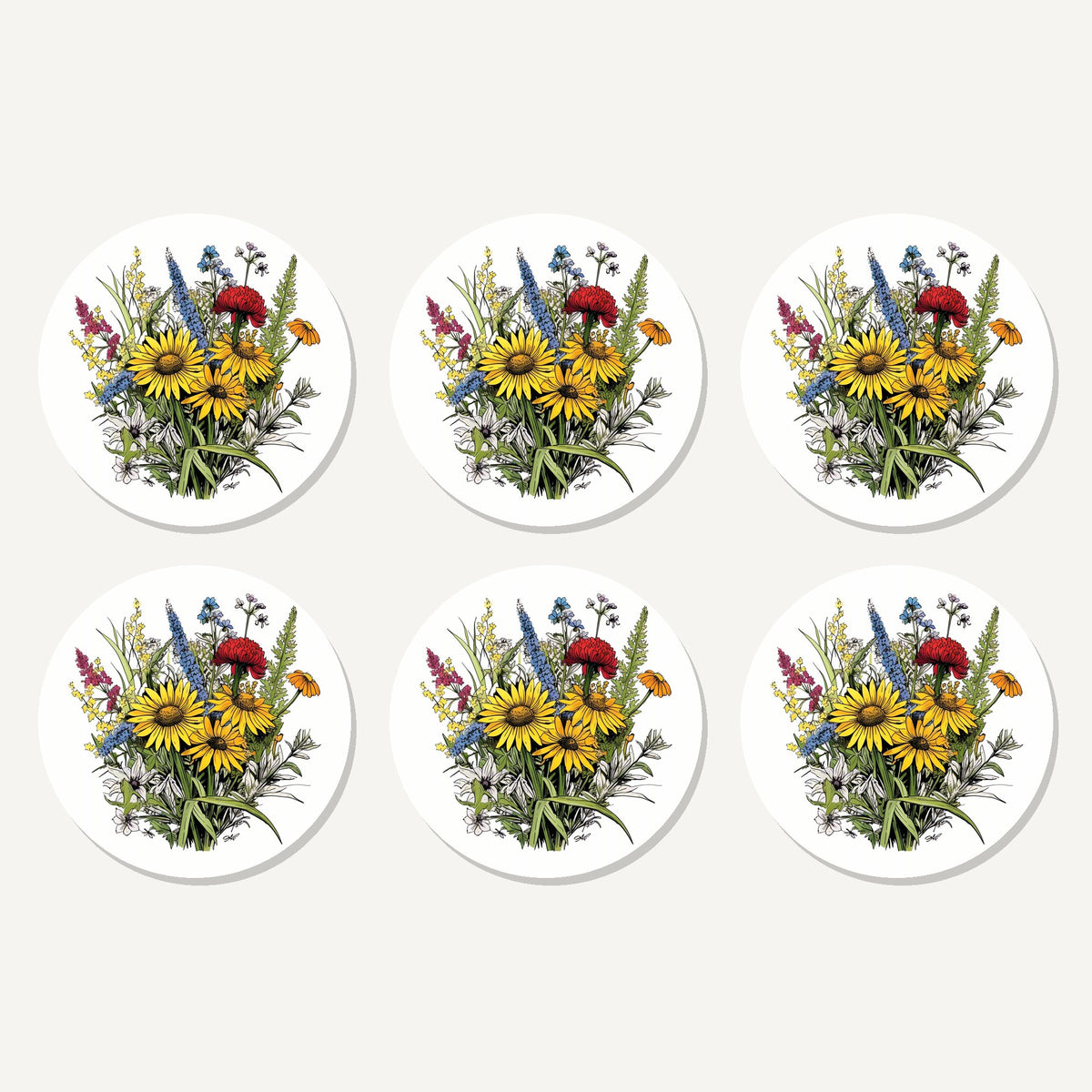 Flat lay of the sunflower bouquet with blue spires artwork on six round coasters