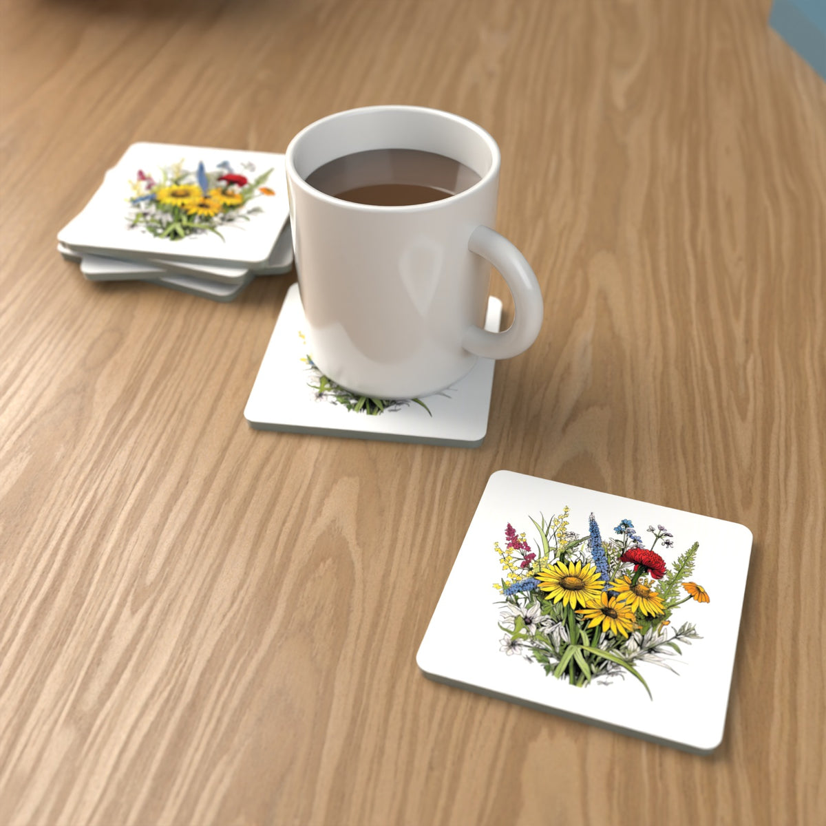 Sunflower Bouquet with Blue Spires Square Glass Coasters – Set of 6 – lifestyle mockup with a mug of coffee
