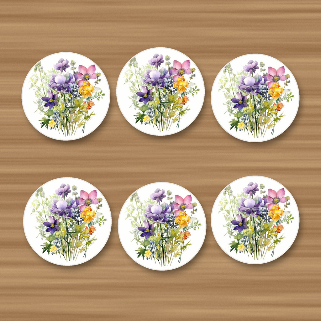 Purple & Pink Wildflower Bouquet round ceramic coasters, set of 6, on an oak coffee table