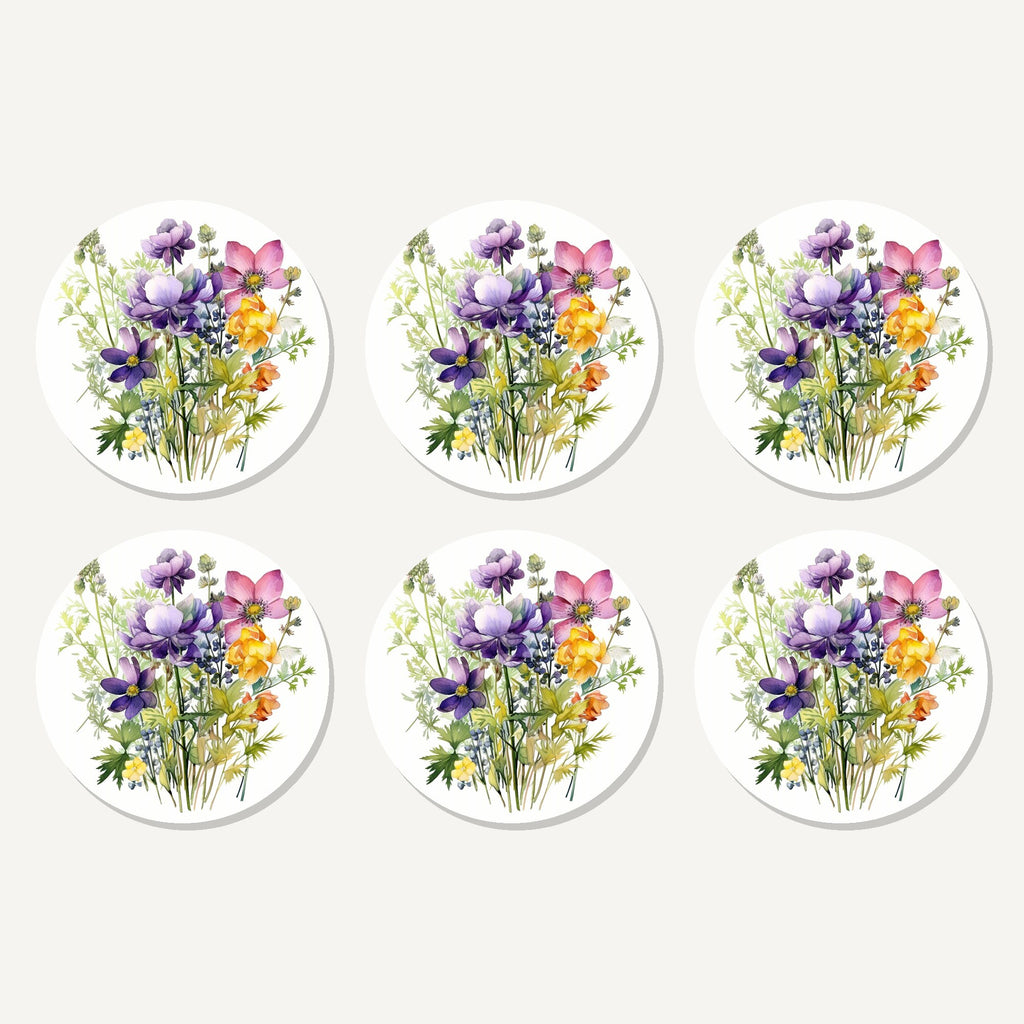 Flat lay of the purple & pink wildflower bouquet artwork on six round coasters