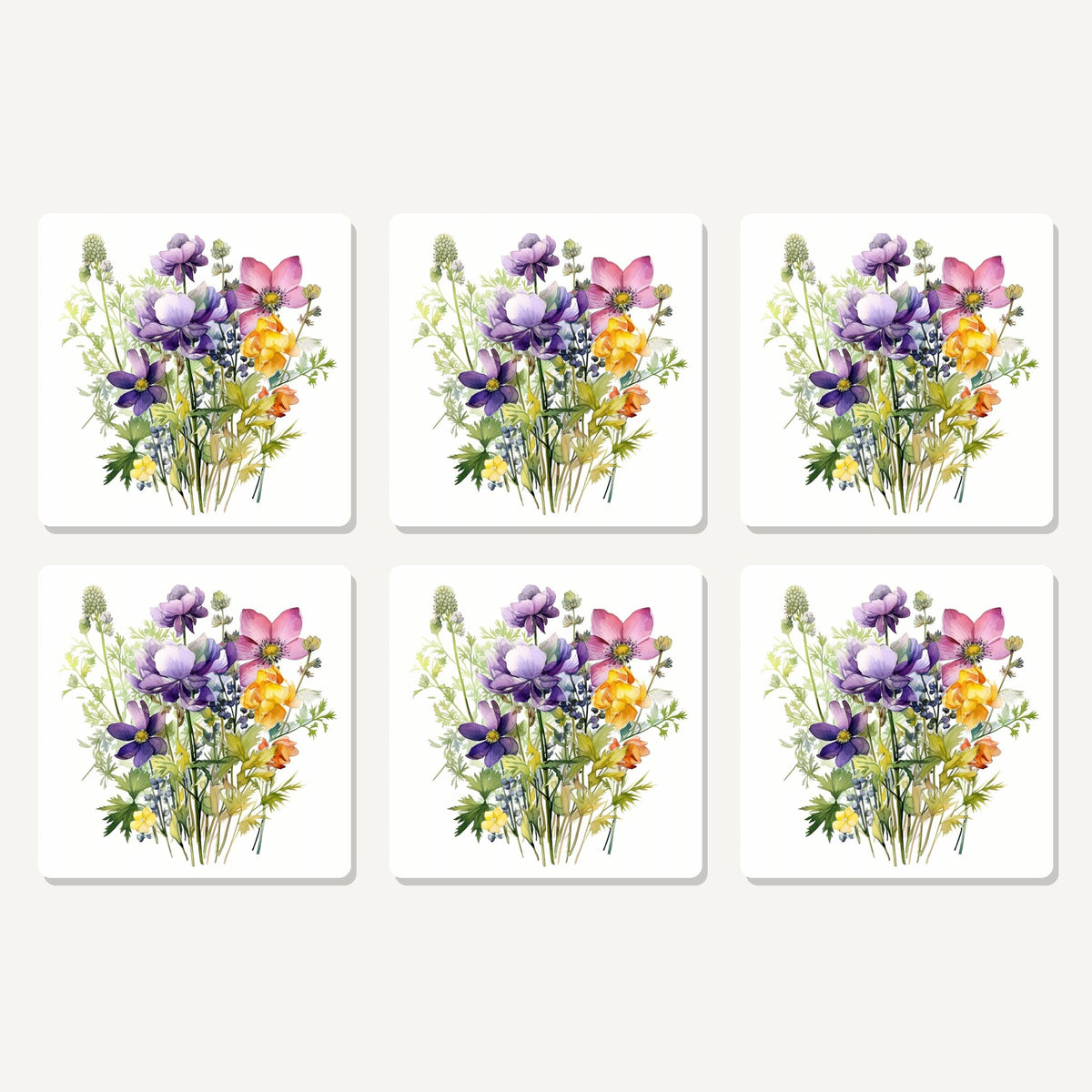 Flat lay of the purple & pink wildflower bouquet artwork on six square coasters