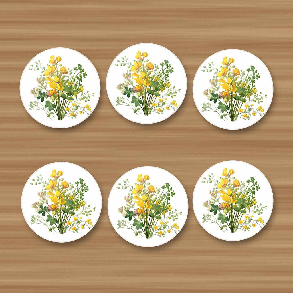 Yellow Buttercup Posy round ceramic coasters, set of 6, on an oak coffee table