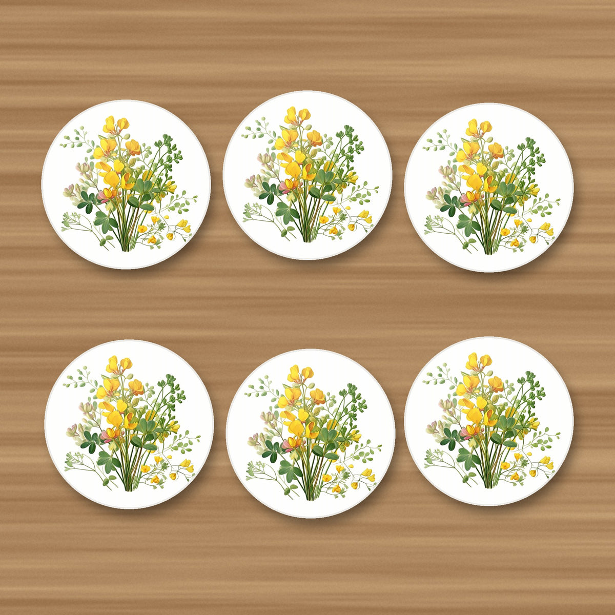 Yellow Buttercup Posy round ceramic coasters, set of 6, on an oak coffee table
