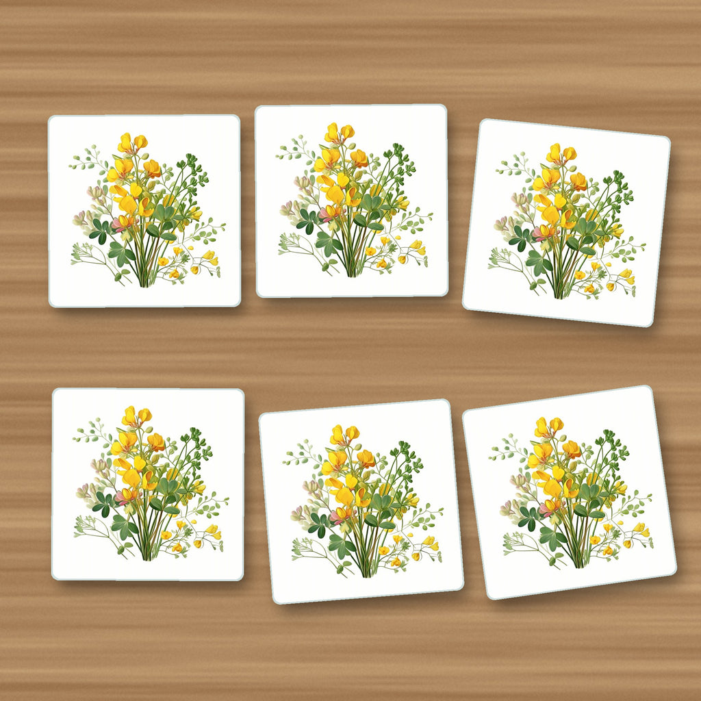 Yellow Buttercup Posy square glass coasters, set of 6, on an oak coffee table