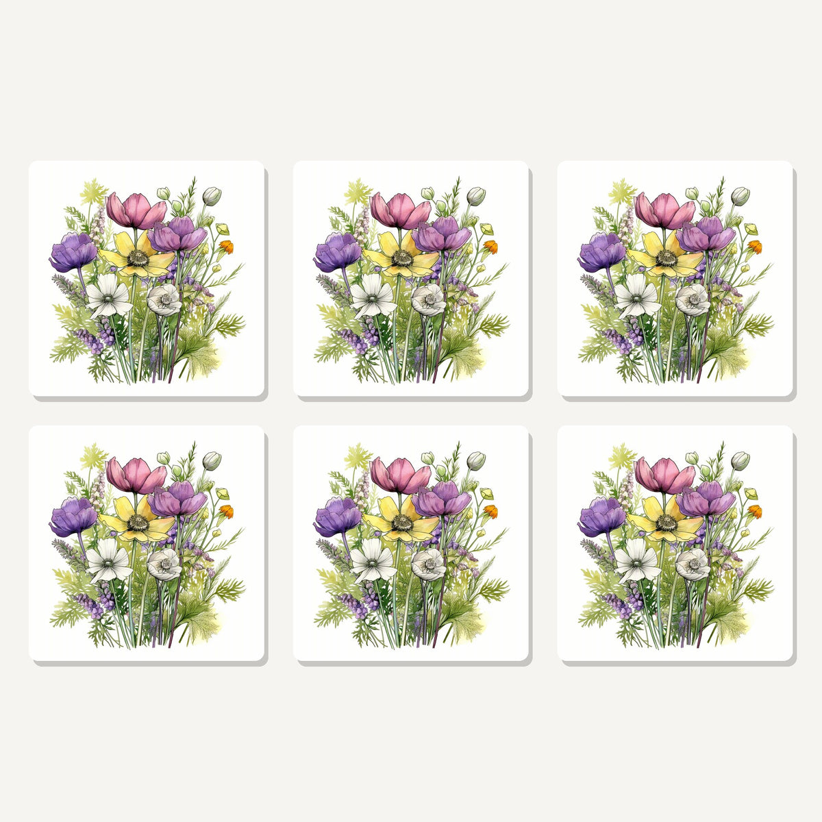 Flat lay of the pink, purple & white wild bouquet artwork on six square coasters