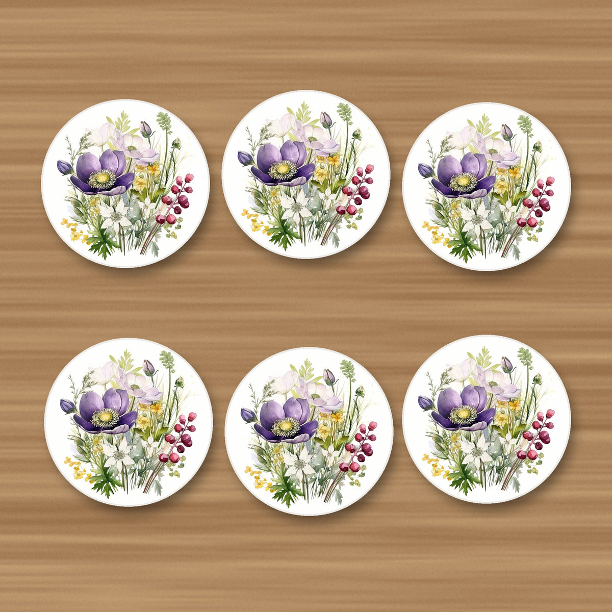 Purple Anemone & Berry Bouquet round ceramic coasters, set of 6, on an oak coffee table