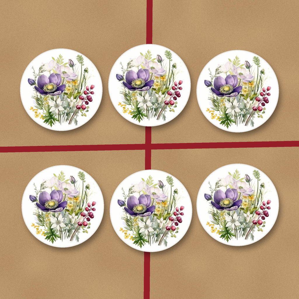 Purple Anemone & Berry Bouquet round ceramic coasters on kraft gift wrap
