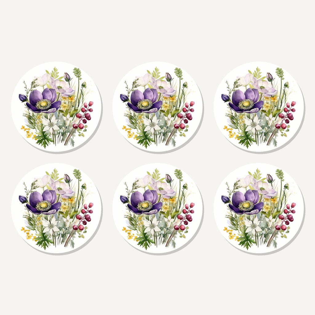 Flat lay of the purple anemone & berry bouquet artwork on six round coasters