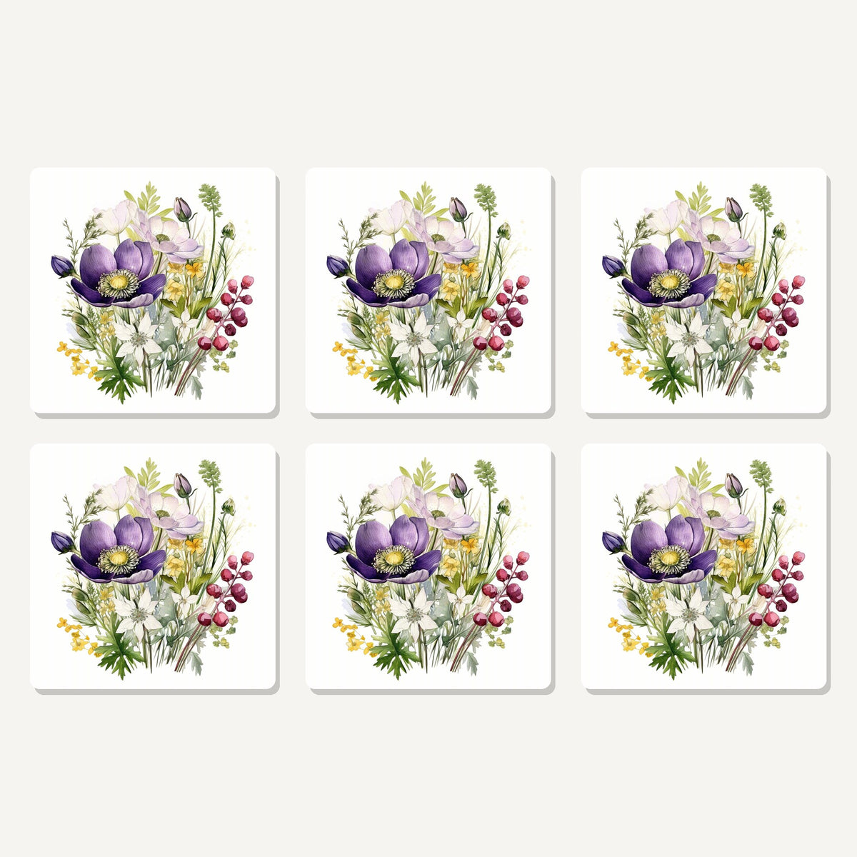 Flat lay of the purple anemone & berry bouquet artwork on six square coasters