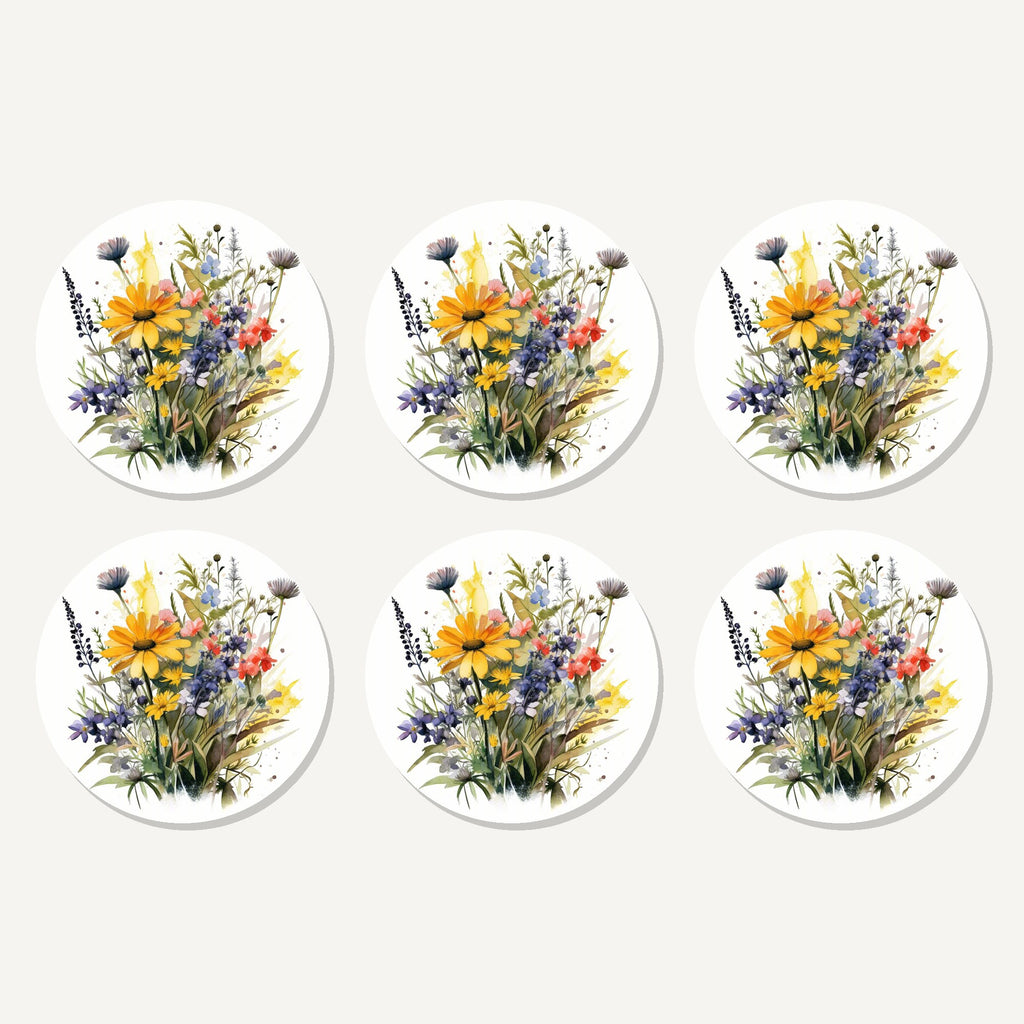 Flat lay of the yellow & blue meadow bouquet artwork on six round coasters