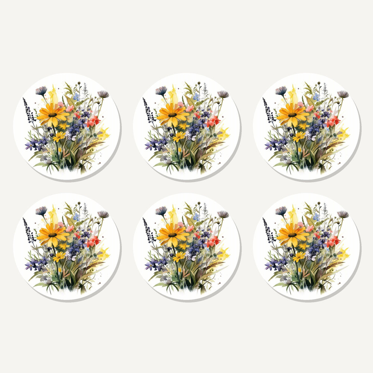 Flat lay of the yellow & blue meadow bouquet artwork on six round coasters