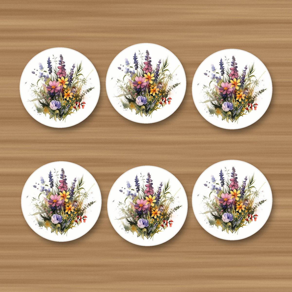 Pink & Purple Watercolour Wildflowers round ceramic coasters, set of 6, on an oak coffee table
