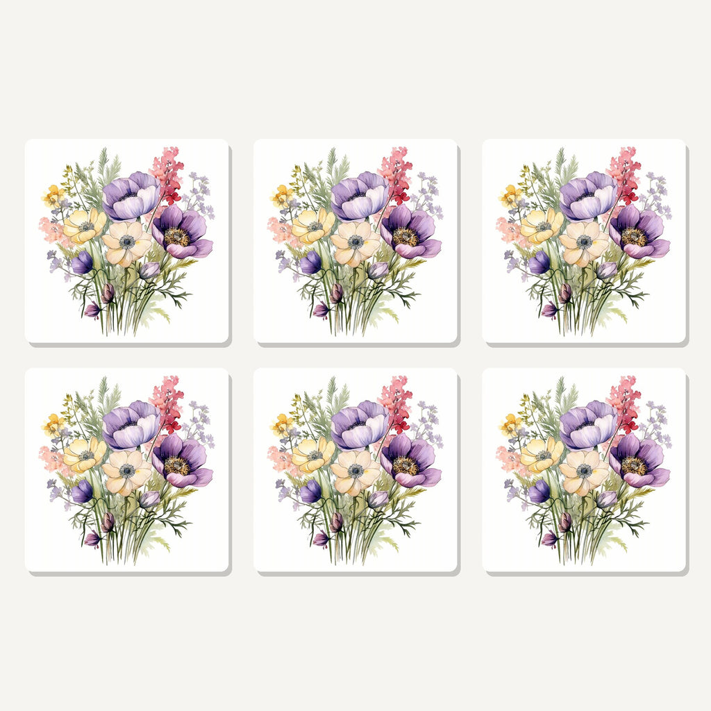 Flat lay of the lilac & cream anemone bouquet artwork on six square coasters
