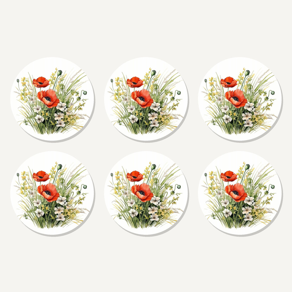 Flat lay of the red poppy & meadow grass artwork on six round coasters