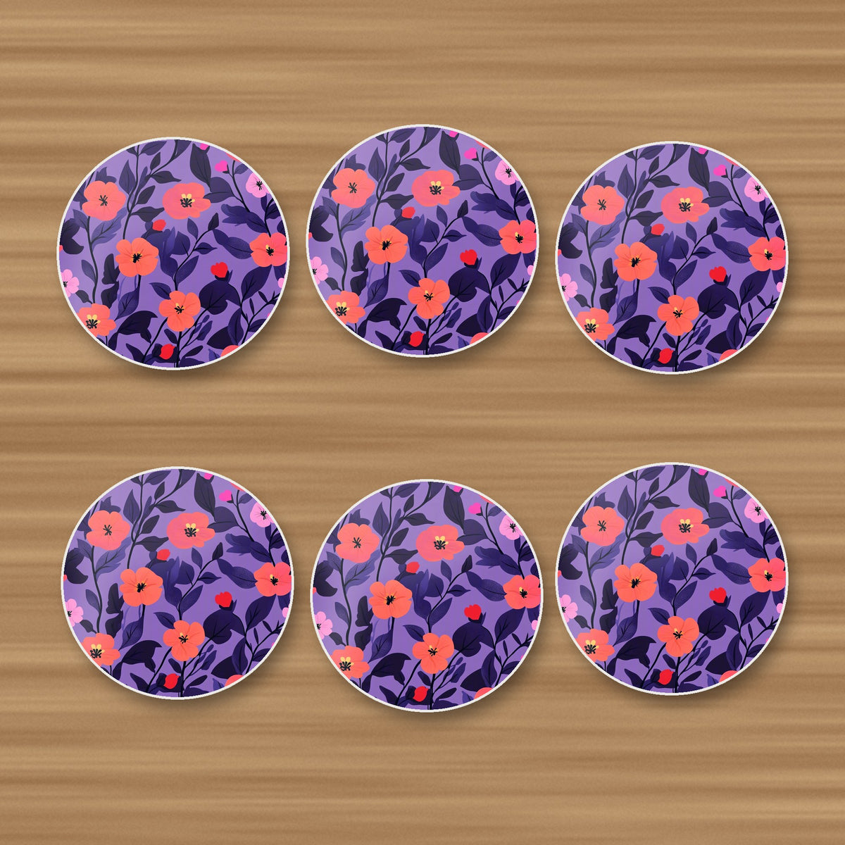 Coral Flowers on Purple Pattern round ceramic coasters, set of 6, on an oak coffee table