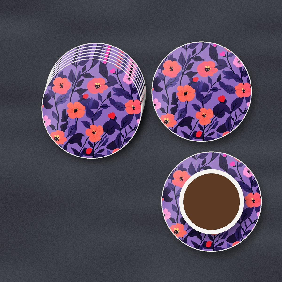 Coral Flowers on Purple Pattern round ceramic coasters stacked on a slate kitchen worktop