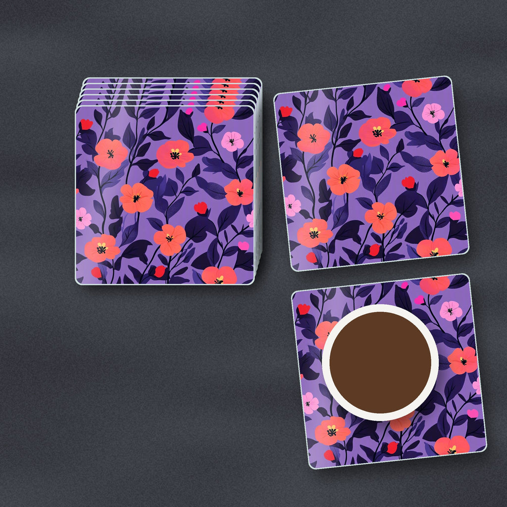 Coral Flowers on Purple Pattern square glass coasters stacked on a slate kitchen worktop