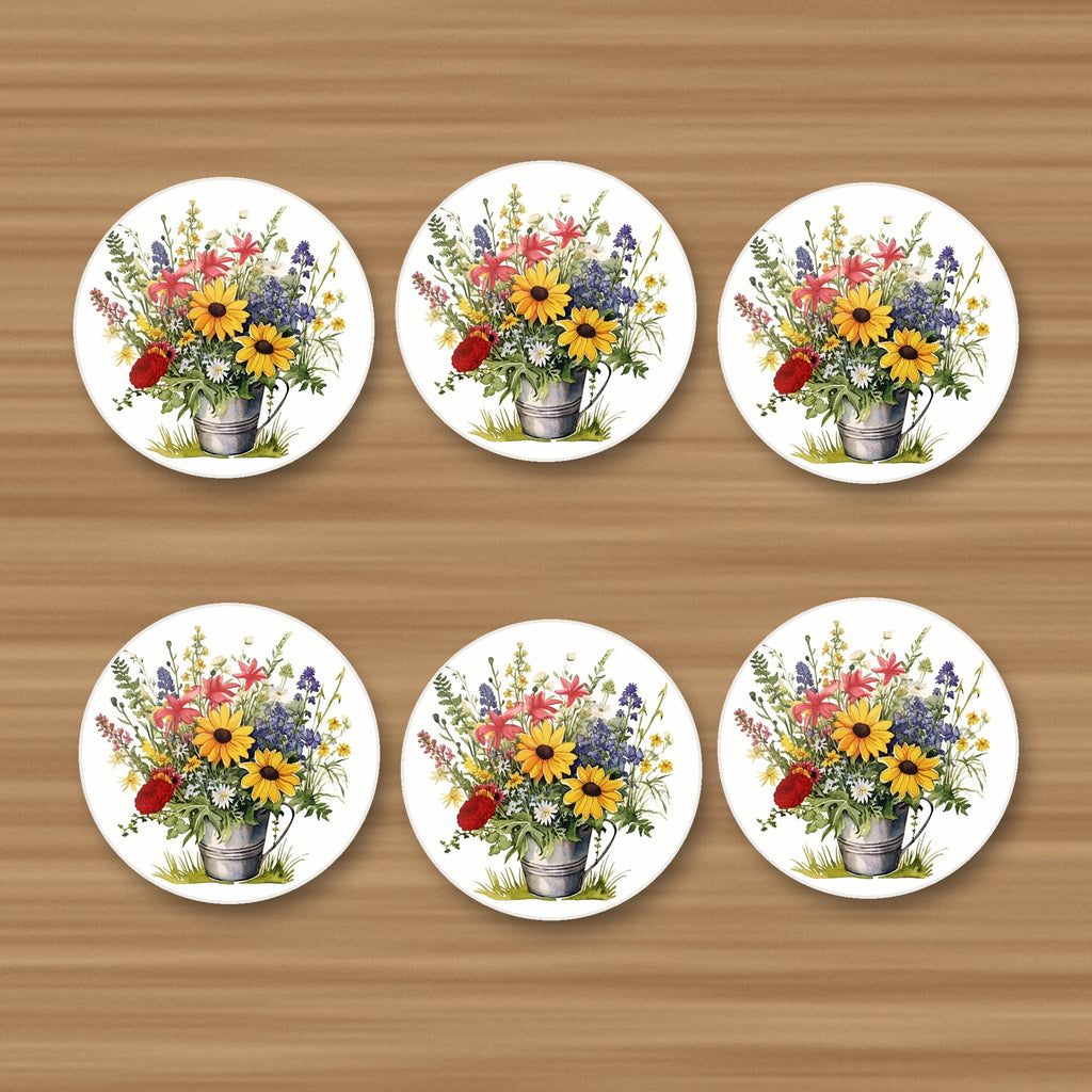 Sunflowers in a Tin Bucket round ceramic coasters, set of 6, on an oak coffee table